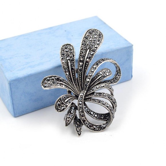 Брошь Завитки с марказитами