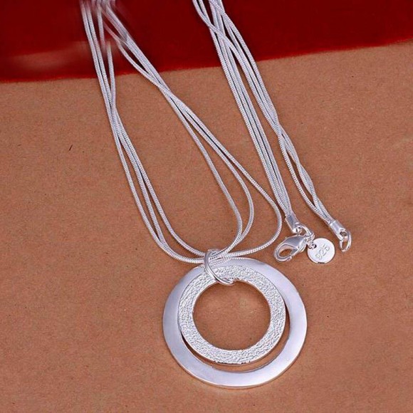 Набір прикрас Кільця посріблений: кулон і сережки