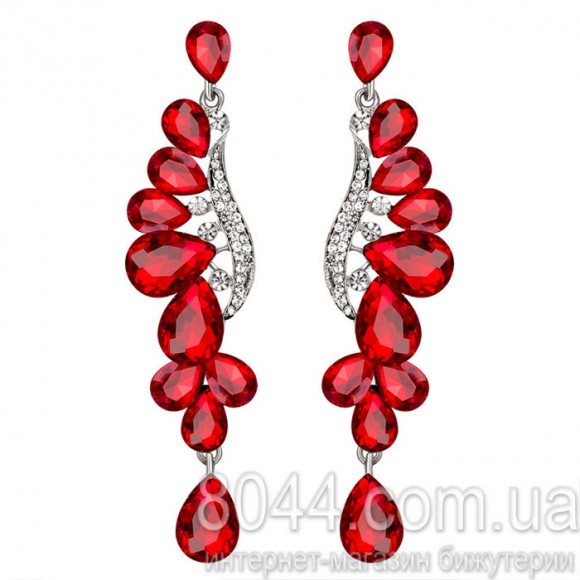 Довгі сережки з камінням сваровськи.