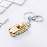 Брелок для ключей Спортивная машина с фонариком золотистого цвета